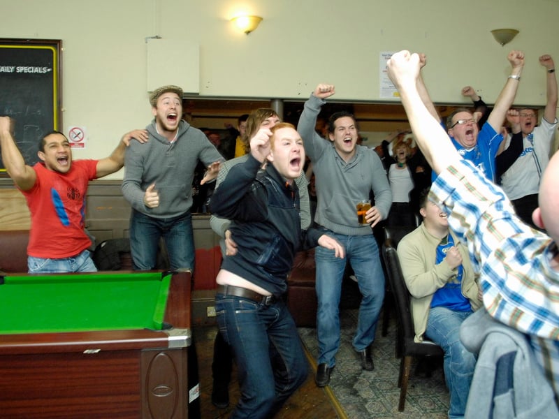 These Pompey fans celebrate the Blues' 4-1 win at Southampton in the FA Cup in 2010.