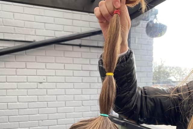 Charlie Wheeler chopped off his 40cm ponytail in aid of the Little Princess Trust.