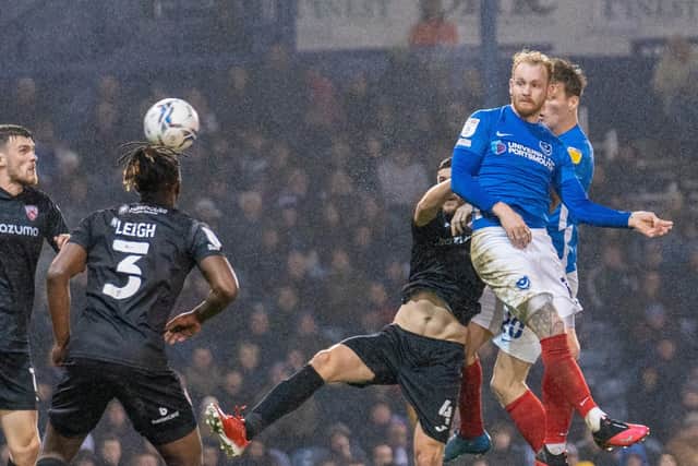 Conor Ogilvie, pictured heading home Pompey's second goal, is the choice of Simon Denyer as man of the match. Picture: Stephen Flynn/ProSportsImages