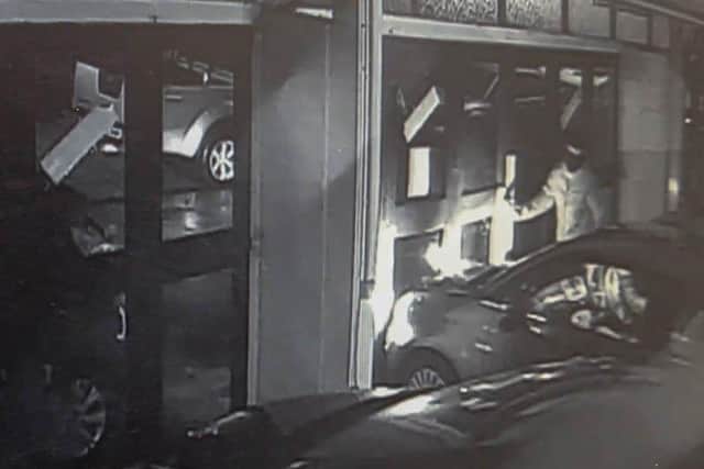 Pictured: CCTV still showing when theives drove the car out of the shop of GT Hewett & Son Garage, Copnor, Portsmouth