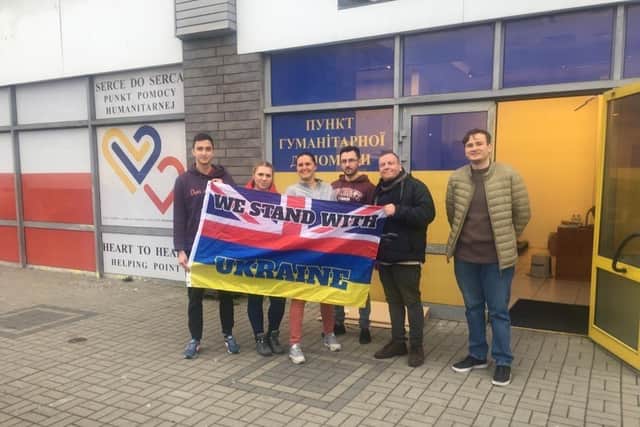 David Sheppard and his co-driver,, Salah Mustafa, travelled all the way to Ukraine to donate aid supplies. Here they are pictured outside the donation centre on the Poland-Ukraine border. Picture: David Sheppard.