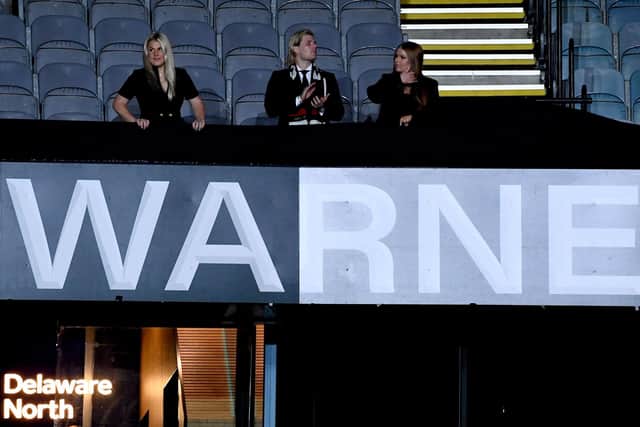 Shane Warne's children - Jackson Warne (centre), Summer Warne (right) and Brooke Warne - unveil the Shane Warne Stand during the state memorial service for their father. Photo by William WEST / AFP)