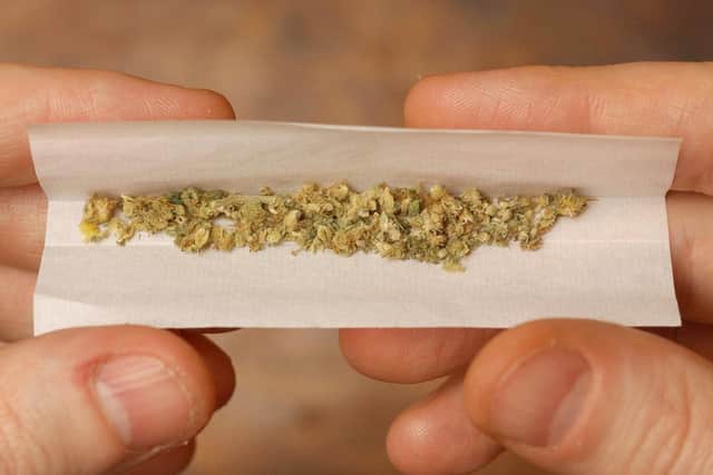 A cannabis joint pictured being prepared. Photo: Matthew Fearn