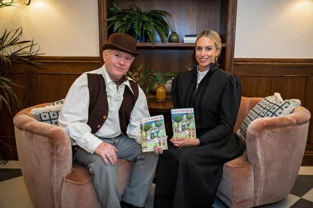 Tim Lowe (62) with Ellena Napier (35) at the launch for the new book by Jack Wells, 'The Mystery of Southsea's Laughing Sailor'. Picture: Mike Cooter (060821)