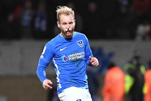 Connor Ogilvie with swabs up both nostrils after Sam Smith 'flattened' his nose in Pompey's goalless draw at Cambridge United. Picture: Dennis Goodwin/ProSportsImages