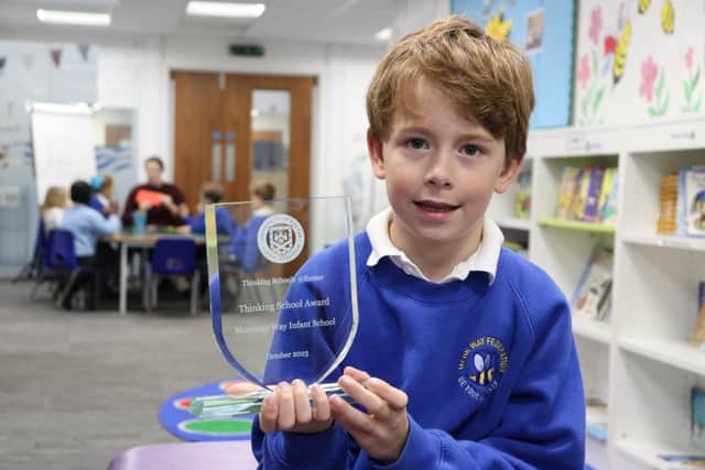 Moorings Way Infant School - Holding the trophy to recognise the schools Thinking Trophy loud and proud.
Picture: Samuel Poole.