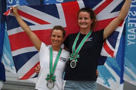 Britain's Hannah Mills and Eilidh McIntyre, right, celebrate second place in the women's two person Dinghy 470 class medal competition at a sailing test event for the Tokyo Olympics at Enoshima Yacht Harbour, August 2019. Photo by CHARLY TRIBALLEAU / AFP via Getty Images.
