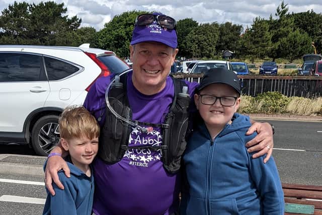 Doug with his two grandchildren, (from l to r) Rudy and Leo.
