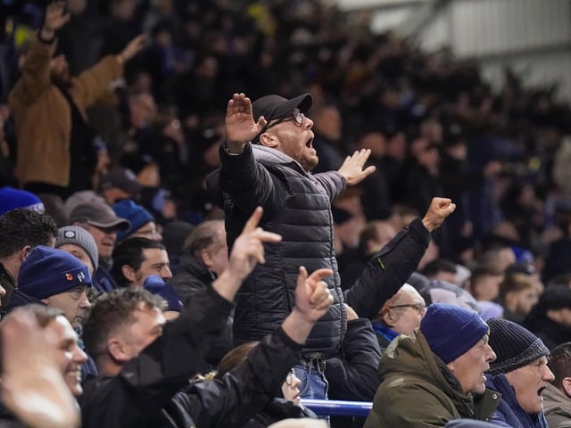 Pompey fans backed their team to a crucial Championship survival win over Cardiff last night.