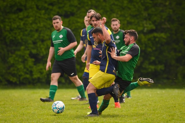 Action from Saturn Royale's 1-0 win over Pelham Arms (blue and yellow kit) in the second Adelaide Cup semi-final. Picture: Keith Woodland (300421-768)