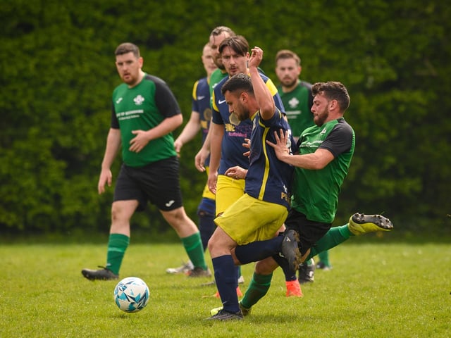 Action from Saturn Royale's 1-0 win over Pelham Arms (blue and yellow kit) in the second Adelaide Cup semi-final. Picture: Keith Woodland (300421-768)