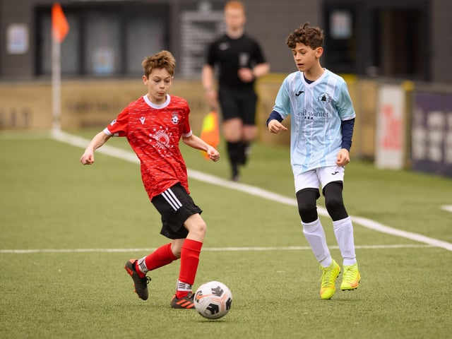 Action from the Portsmouth Youth League Geldard Invitation Cup final between Jubilee 77 U13s and Castle United U13s (light blue and white kit). Picture: Keith Woodland (190321-573)