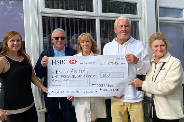 Cheque presentation: Hollie from Enable Ability, with Mark, Martine, Barry and Anne from MGMS