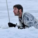 Guy Martin climbing out of a pit of ice cold water. He featured in a new series called Guy Martin: Arctic Warrior on Channel 4 (Picture: Royal Navy/Channel 4)