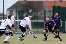 Terry Exton, right, in possession for Portsmouth 2nds during their home defeat against Isle of Wight. Picture: Chris Moorhouse