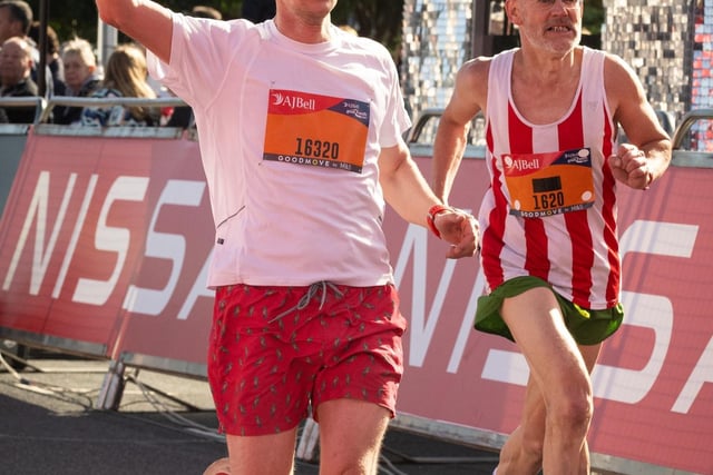 Pictured is: Runners cross the line to finish
Picture: Keith Woodland (151021-614)