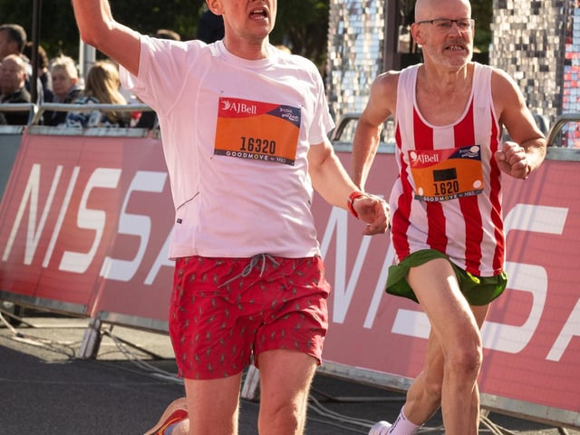 Pictured is: Runners cross the line to finish
Picture: Keith Woodland (151021-614)