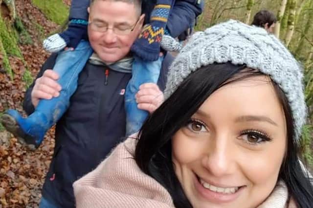 Amy Oliver, front, pictured with dad Andrew, rear, who is carrying his grandson Charlie, five.