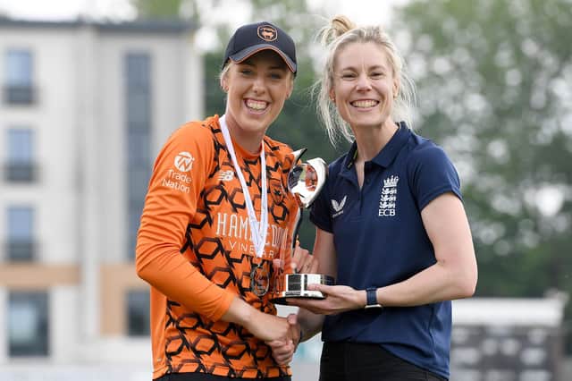 Georgia Adams, left, is presented with the Charlotte Edwards Cup after last Sunday's win against The Blaze in Worcester. Picture: Tony Marshall/Getty Images