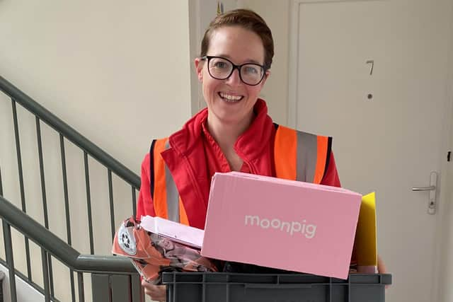 Postie Sarah arrives with the birthday cards