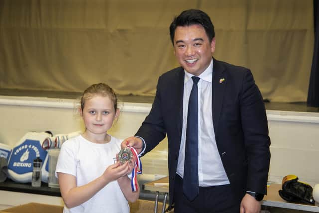 Phoebe Perry presents Alan Mak MP with an endeavour medal