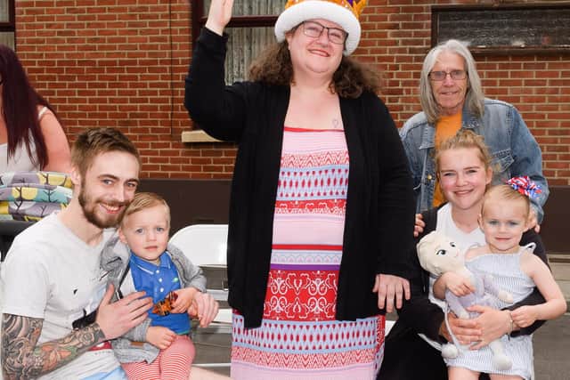 Pictured is: Deon, Teddy, 2, Vanessa Marples with the Crown, Emily, Willow, 3 and Bill. North End residents. Picture: Keith Woodland (030621-6).