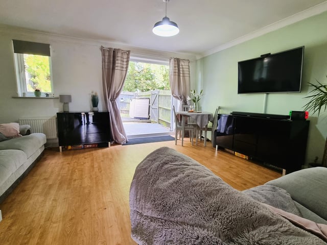 The lounge features double glazed French doors leading to the rear garden.