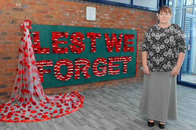 Jane Wilkinson from Portchester, along with other Portchester residents have been creating a poppy memorial since January 2020 and is displayed at Portchester Health Centre. Picture: Sarah Standing (061120-8065)