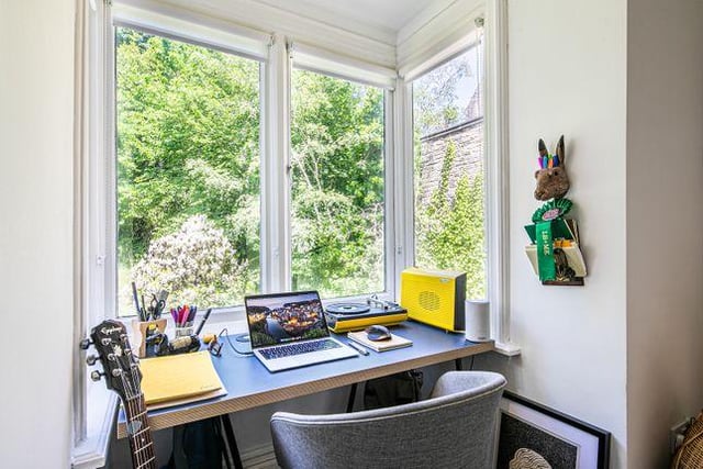 The current owners are making the most out of the bay windows by fitting in a desk.