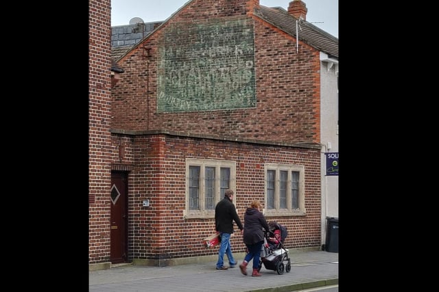 A faded sign above what is now Hashtag Hair in Winter Road, near the Westfield Road junction. Discernible words include: '94, English and Poultry.'