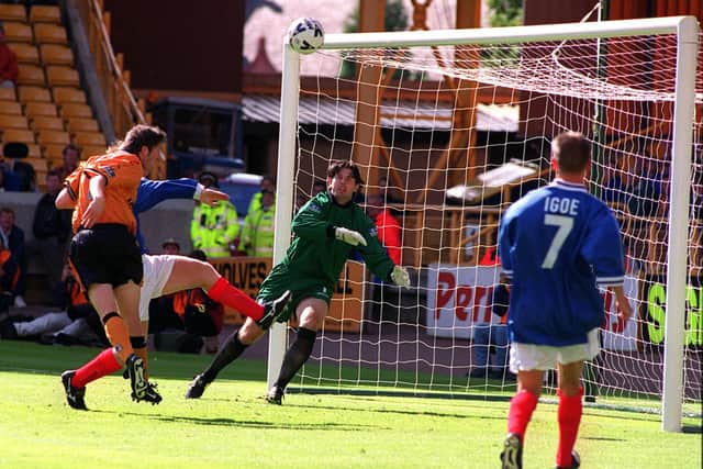 Wolves' Robbie Keane heads just over in the 1-1 draw with Pompey in August 1999. Picture: Richard Thompson