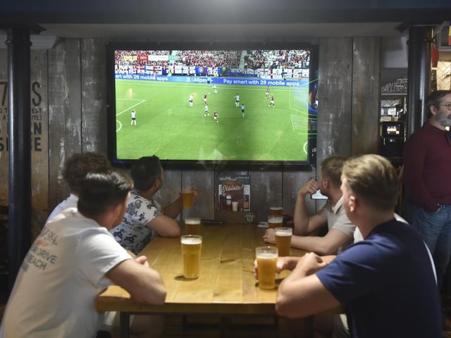 England fans at O'Neils in Albert Road, Southsea, watching the England v Denmark match in the Euro's.Picture: Sarah Standing (200624-4639)
