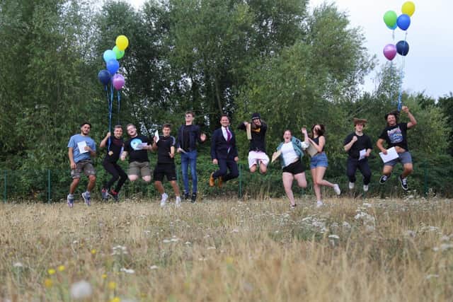 Students celebrating their results at City of Portsmouth College. Stephen Morgan MP is joining in with the festivities. Picture: Habibur Rahman.