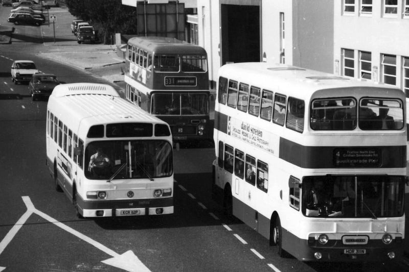 A cluster of buses are lit by the evening sun during July 1981 from the vantage point of the Hilsea footbridge. You can see the old depot in the background which was later demolished and has now been replaced with flats.