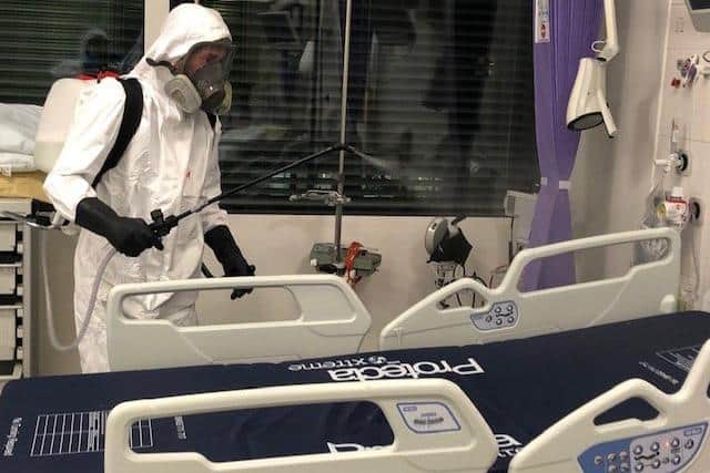 Jim Gildea is working 16-hour days with his company Total Trauma Cleaning carrying out infection prevention control cleans for Covid-19 during the coronavirus outbreak. Pictured at a job in England on March 22 cleaning ventilators and beds at a makeshift intensive care unit. The images are not of Queen Alexandra Hospital in Cosham.
