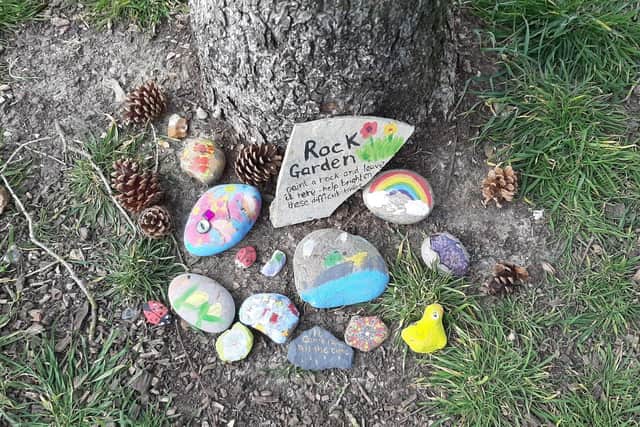 Lillith McVicar, six, set up this community rock garden with her mum Jenni McVicar to spread a bit of joy in these times - it now has more than 100 rocks. Pictured: The rock garden when they started it on April 1