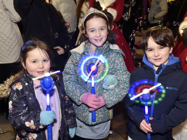 Christmas lights in High Street, Cosham, were switched on during the evening of Friday, November 22, 2024.Pictured is: (l-r) Penelope (4), Athena (7) and Alexander Lloyd (6) from Soberton.Picture: Sarah Standing (221124-6404)