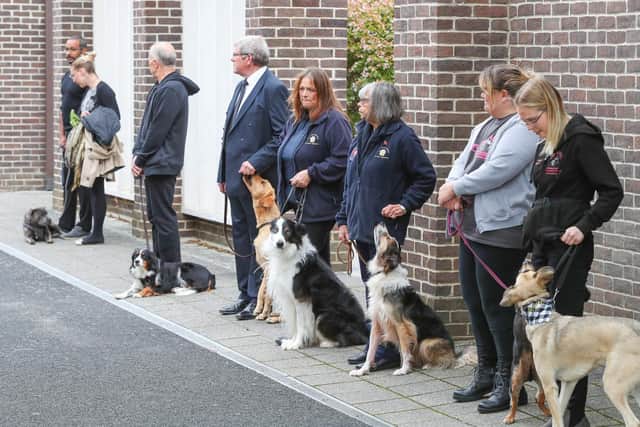 Rosie Chase's riends and colleagues at The Academy of Modern Canine Behaviour and training form a dog line for her as she enters the chapel.
Picture: Stuart Martin (220421-7042)