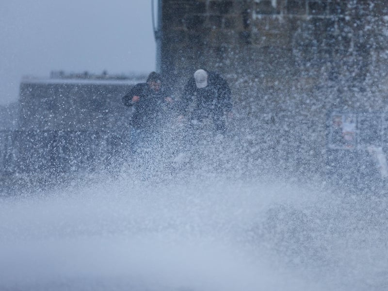 The stormy sea at high tide crashed waves onto footpaths as passer-by's did their best to get out the way. Some where luckier than others