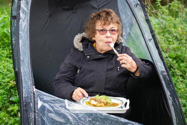 Angela Barnes and her friend Janice Burkinshaw are both widows who have supported each other through the Covid restrictions. As they can no longer enjoy Sunday dinner in Janice's garden they bought pop-up pods which they put up on Milton Common to enjoy a 2-course dinner

Pictured: Janice Burkinshaw with her meal    in Milton Common,  Portsmouth on 11 November 2020.

Picture: Habibur Rahman