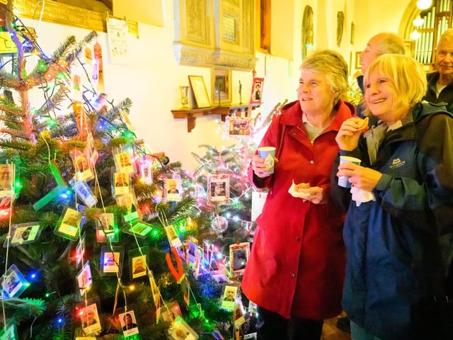 Pictured is: Susan Barker and Susan Tingley with the mulled wine and mince pies admiring one of the many trees at the event
Picture: Keith Woodland (071221-74)