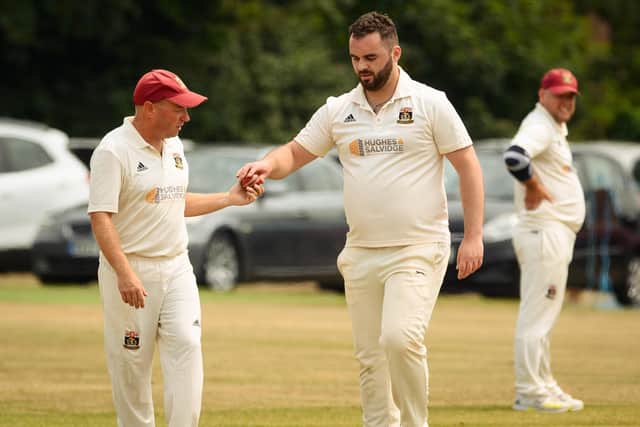 Peter Briggs, right, took three wickets as Fareham & Crofton routed US Portsmouth for 98. Picture: Keith Woodland