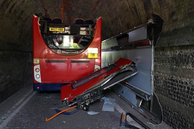 The scene on Wellhouse Lane in Winchester after three children were taken to hospital with serious injuries while 12 others suffered minor injuries after the school bus they were travelling in crashed into a railway bridge. Picture: Andrew Matthews/PA Wire