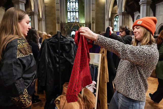 Charly Dennes (left) and Sarah Chamberlain hunt for bargains at Worth the Weight Vintage Kilo Sale, St Mary's Church, Fratton. Picture: Chris Moorhouse (010225-43)