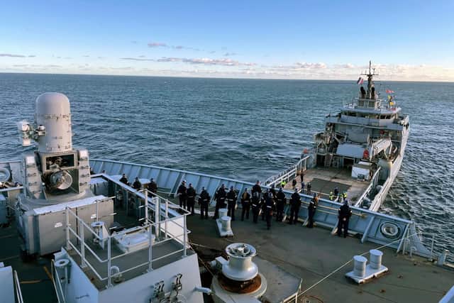 The FS Garonne towing assault ship HMS Albion on November 4, 2021.