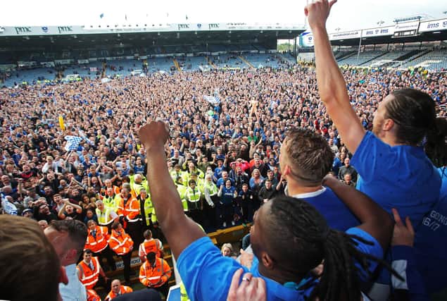 Stanley Aborah celebrates the League Two title with his team-mates at Fratton Park in May 2017. Picture: Joe Pepler