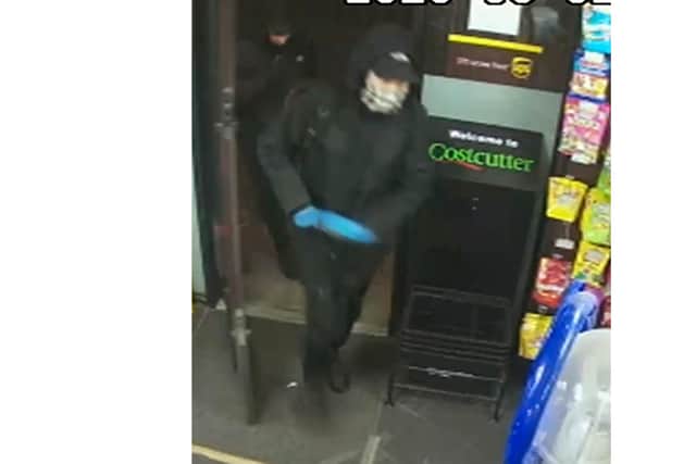 One of the Costcutters robbers.