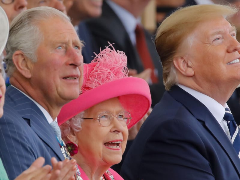 (L-R) Britain's Prime Minister Theresa May, Britain's Prince Charles, Prince of Wales, Britain's Queen Elizabeth II and US President Donald Trump look up as aircraft perform a fly-over during an event to commemorate the 75th anniversary of the D-Day landings on June 5, 2019.