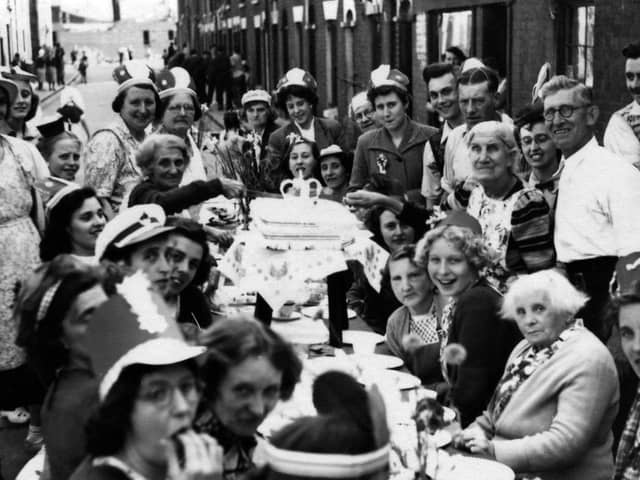 A coronation party in 1953 in Seymour Street, Buckland, with Elizabeth Johnson cutting the cake