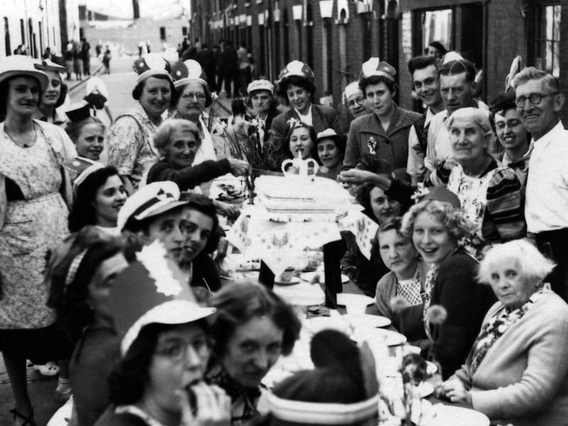 A coronation party in 1953 in Seymour Street, Buckland, with Elizabeth Johnson cutting the cake